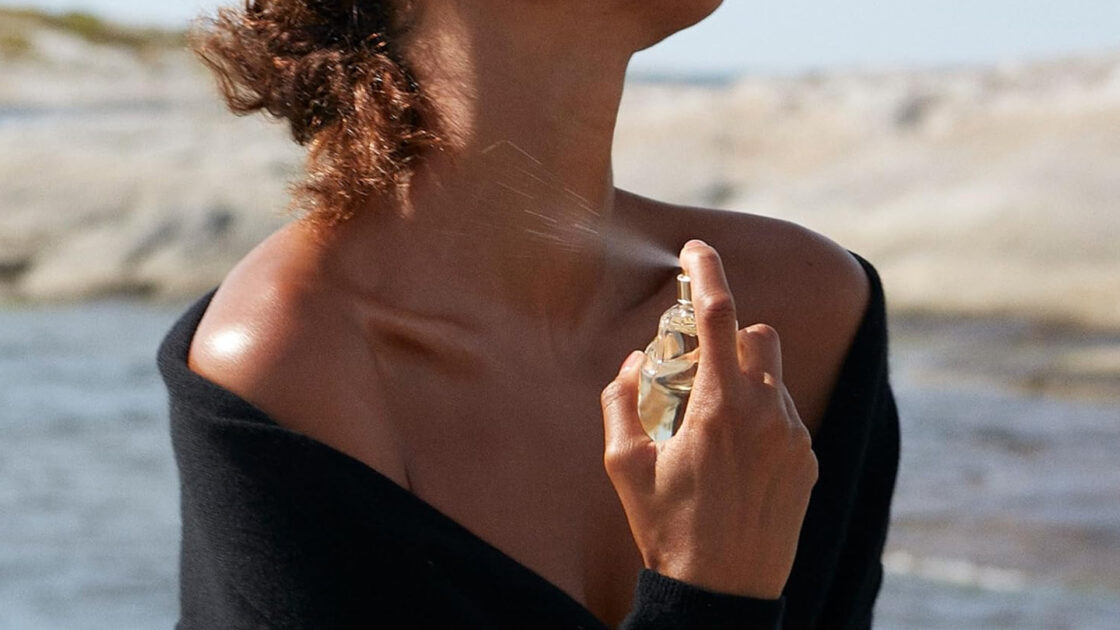 Donna Karan Cashmere Mist Fragrance Being Used by a Model