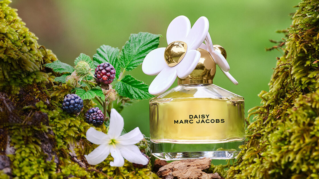 Marc Jacobs Daisy Bottle on a Forest with Notes Background